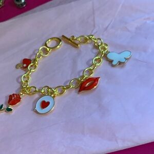 Gold Tone Charm Bracelet with Red & White Enamel Charms